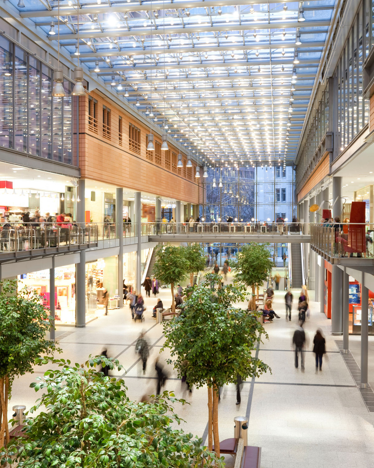 Shopping centre interior with retail storefronts